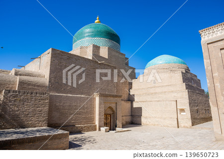 Exterior view of the Pahlavan Mahmud Mausoleum at Ichan Kala, a UNESCO World Heritage Site in Khiva, Uzbekistan. Exterior view of the Pahlavan Mahmud Mausoleum at Ichan Kala, a UNESCO World Heritage Site in Khiva, Uzbekistan. 139650723