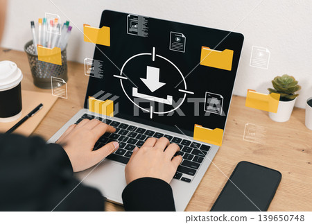 Digital file download and document storage management concept. User using laptop with virtual download icon, folders, media files, reports, data transfer, online archive, backup and paperless workflow 139650748