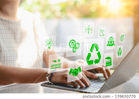 Sustainable development planning concept. A woman using a laptop with virtual icons related to recycling, renewable energy, and environmental protection. business sustainability investment strategy, Sustainable development planning concept. A woman using a laptop with virtual icons related to recycling, renewable energy, and environmental protection. business sustainability investment strategy, 139650770