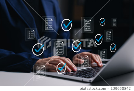 Document checklist approval and workflow verification concept. Professional using laptop with approved files, check marks, task validation, compliance review, quality control, business productivity Document checklist approval and workflow verification concept. Professional using laptop with approved files, check marks, task validation, compliance review, quality control, business productivity 139650842