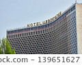 Facade of Hotel Uzbekistan. Soviet modernist architecture, iconic concrete grid pattern. Famous landmark building representing historic landmark, travel destination. Tashkent, Uzbekistan - 3 APR 2026 139651627