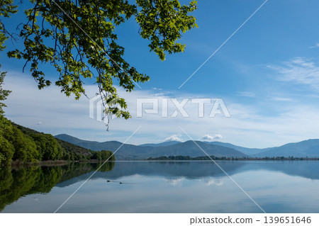 Greece, Kastoria: Reflection of mountains and clouds on Lake Orestiada 139651646