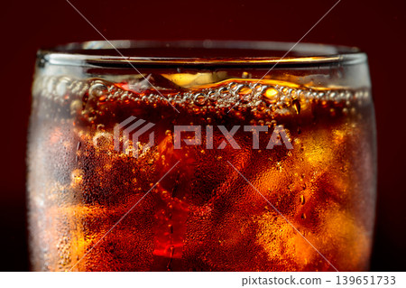 Fizz sparkling cola bubbly soda pop with ice cubes. 139651733