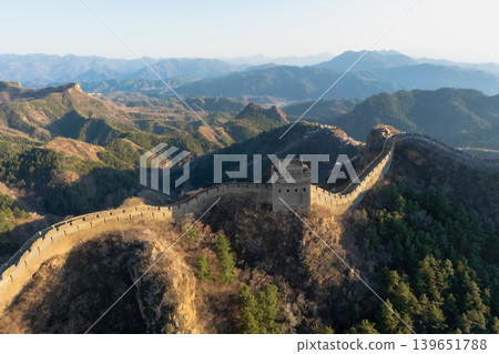 aerial view the ancient fortress stands atop rugged mountain range. China. 139651788