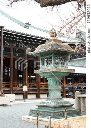 A historical bronze lantern standing in the grounds of a Japanese temple. A historical bronze lantern standing in the grounds of a Japanese temple. 139652013