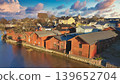 Porvoo, Finland - December 08, 2020: Scenic view of colorful wooden houses along the riverbank in Finland, showcasing charming architecture and natural beauty 139652704
