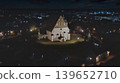 Porvoo, Finland - December 08, 2020: Aerial view of a historic church illuminated at night, surrounded by a charming town, showcasing architectural beauty and serene ambiance 139652710