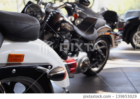 Classic motorbikes for sale in a dealership showroom Classic motorbikes for sale in a dealership showroom 139653029