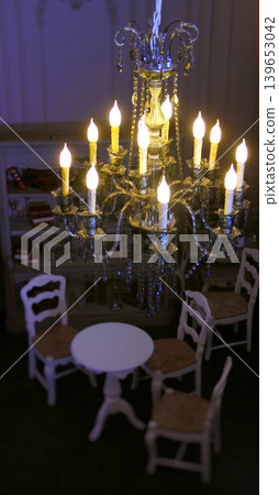 Hanging ceiling chandelier with gold and crystal decoration in classic vintage interior Hanging ceiling chandelier with gold and crystal decoration in classic vintage interior 139653042