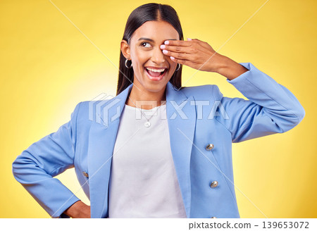 Fashion, smile and vision with a business indian woman on a yellow background in studio for work style. Hand, eye and a happy young professional person thinking of an idea for her corporate future Fashion, smile and vision with a business indian woman on a yellow background in studio for work style. Hand, eye and a happy young professional person thinking of an idea for her corporate future 139653072