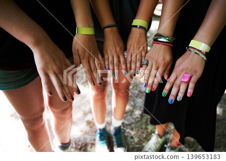 Hands, manicure and woman friends at music festival together, in a circle outdoor closeup from above. Party, concert or show with a group of people at a carnival for performance or entertainment Hands, manicure and woman friends at music festival together, in a circle outdoor closeup from above. Party, concert or show with a group of people at a carnival for performance or entertainment 139653183