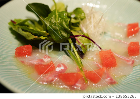 Thinly sliced fresh sea bream and grapefruit salad, Japanese-style carpaccio Thinly sliced fresh sea bream and grapefruit salad, Japanese-style carpaccio 139653263