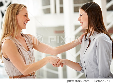 Collaboration, smile and handshake with business women in the office for promotion, bonus or increase. Thank you, welcome or congratulations with a manager and employee shaking hands in agreement Collaboration, smile and handshake with business women in the office for promotion, bonus or increase. Thank you, welcome or congratulations with a manager and employee shaking hands in agreement 139653267