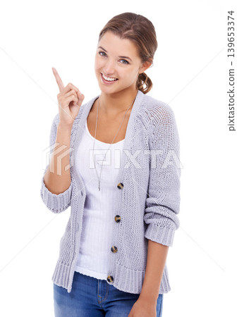 Portrait, fashion and woman with hand pointing in studio for discount, sale or offer on white background. Announcement, face and female model show deal, giveaway or shopping, promotion or information Portrait, fashion and woman with hand pointing in studio for discount, sale or offer on white background. Announcement, face and female model show deal, giveaway or shopping, promotion or information 139653374