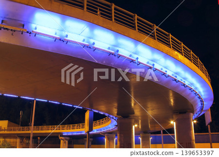 Blue Backlight Of Bridge Over Street At Night City  139653397
