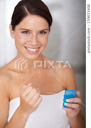Flossing, teeth and portrait of woman in bathroom of home with dental, self care and wellness. Cleaning, tooth and gums for oral healthcare in morning, routine or happy for hygiene or grooming 139653406