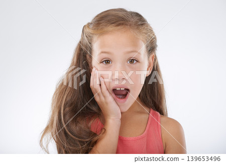 Child, portrait and hand for surprise news in studio for announcement, information or review. Female person, face and shocked on white background for giveaway secret as wow mockup, winner or drama Child, portrait and hand for surprise news in studio for announcement, information or review. Female person, face and shocked on white background for giveaway secret as wow mockup, winner or drama 139653496