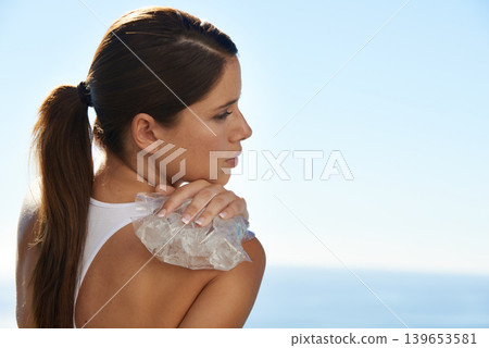 Ice, sports and back of woman with injury, pain or hurt shoulder for outdoor cardio training. Fitness, accident and female athlete with frost pack for inflammation, bruise or sore muscle of running. Ice, sports and back of woman with injury, pain or hurt shoulder for outdoor cardio training. Fitness, accident and female athlete with frost pack for inflammation, bruise or sore muscle of running. 139653581