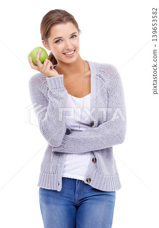 Woman, portrait and apple for detox in studio, organic fiber and fruit for wellness. Female person, vitamins and minerals for healthy living, snack and vegan food on white background for nutrition Woman, portrait and apple for detox in studio, organic fiber and fruit for wellness. Female person, vitamins and minerals for healthy living, snack and vegan food on white background for nutrition 139653582