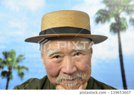 A smiling old man with a beard under a blue sky A smiling old man with a beard under a blue sky 139653607
