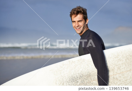 Happy, surfing and portrait of man on beach with surfboard for waves on summer vacation, weekend or holiday by sea. Travel, nature and person by ocean for water sports, adventure and fun in Australia 139653746