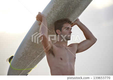 Fitness, beach and man carrying surfboard for wellness, sports and training nature. Ocean, exercise and profile of male surfer at the sea for vacation adventure, travel and journey, hobby or holiday 139653770