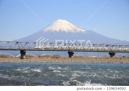 Shinkansen crossing Fuji River with Mt. Fuji in the background Shinkansen crossing Fuji River with Mt. Fuji in the background 139654092