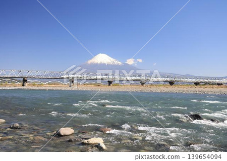 Shinkansen crossing Fuji River with Mt. Fuji in the background 139654094