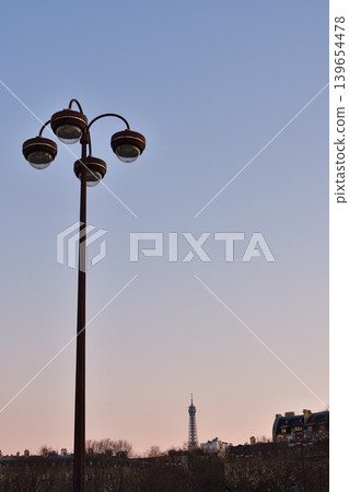 A view of Paris streetlights during magic hour in Place Charles de Gaulle (March 7, 2022) A view of Paris streetlights during magic hour in Place Charles de Gaulle (March 7, 2022) 139654478