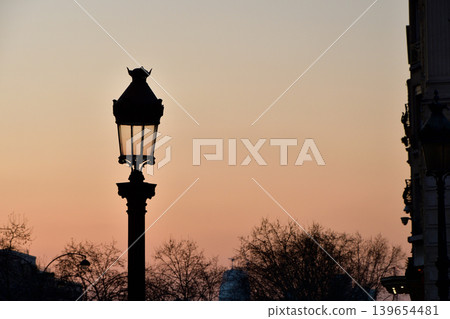 A view of Paris streetlights during magic hour in Place Charles de Gaulle (March 7, 2022) A view of Paris streetlights during magic hour in Place Charles de Gaulle (March 7, 2022) 139654481