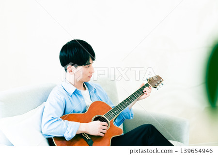 Man playing guitar Man playing guitar 139654946