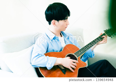 Man playing guitar Man playing guitar 139654948