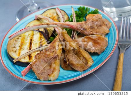 Lamb ribs with aubergine and herbs Lamb ribs with aubergine and herbs 139655215