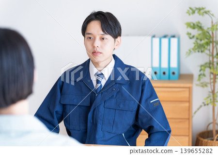 Businessmen in work clothes having a meeting Businessmen in work clothes having a meeting 139655282