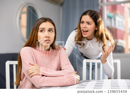 Girlfriend or sister yelling at girl during family quarrel 139655439