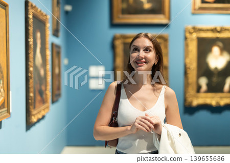 Girl view pictures and icons in museum hall Girl view pictures and icons in museum hall 139655686