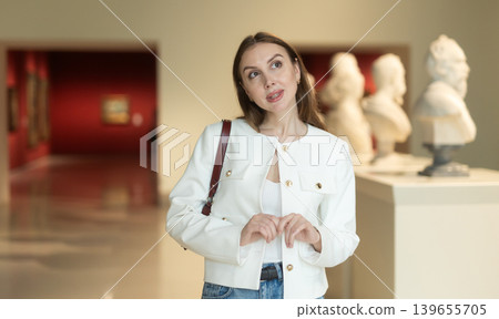 Girl view sculpture in museum hall Girl view sculpture in museum hall 139655705