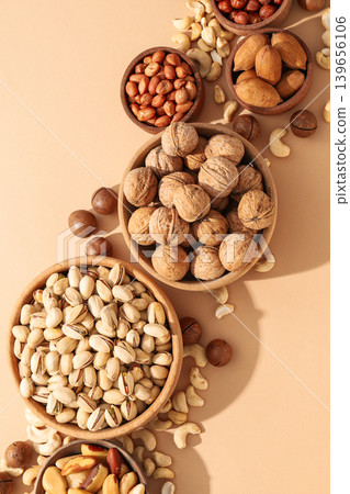 Different nuts and seeds are placed in bowls 139656106