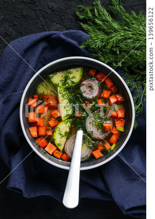Vegetable soup with dill, cucumber, and carrots in a bowl Vegetable soup with dill, cucumber, and carrots in a bowl 139656122