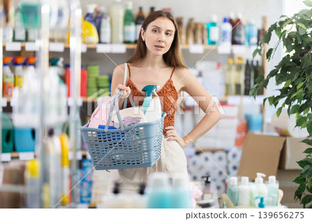 Happy woman shopping for household and hygiene products Happy woman shopping for household and hygiene products 139656275