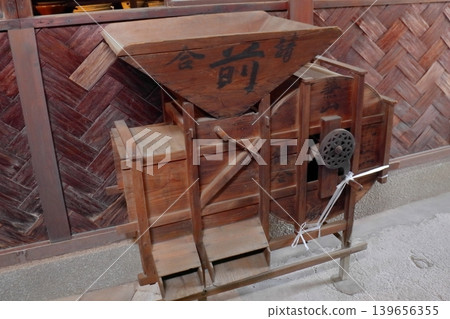 An old-fashioned winnowing machine An old-fashioned winnowing machine 139656355
