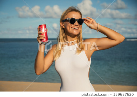 Bali, Indonesia, March 18, 2026: Coca-Cola drink at the beach Bali, Indonesia, March 18, 2026: Coca-Cola drink at the beach 139657620