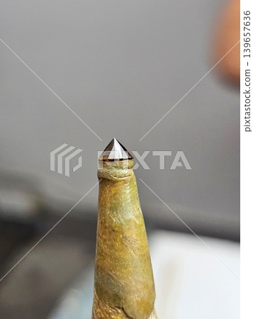 Faceted Cognac Gemstone on Dop Stick for Jewelry Making and Lapidary Process Faceted Cognac Gemstone on Dop Stick for Jewelry Making and Lapidary Process 139657636
