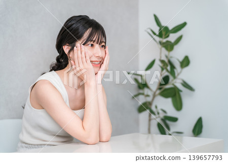 Smiling Asian woman with beautiful skin with a cheek (beauty, esthetic, skin care image) Smiling Asian woman with beautiful skin with a cheek (beauty, esthetic, skin care image) 139657793
