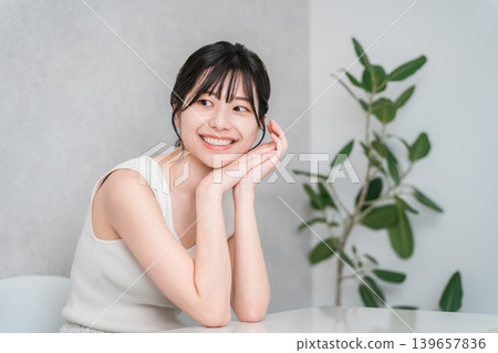 Young Asian woman in a tank top (beauty, makeup, skin care) 139657836