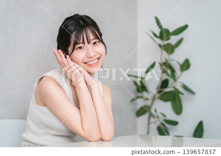 Young Asian woman in a tank top (beauty, makeup, skin care) 139657837
