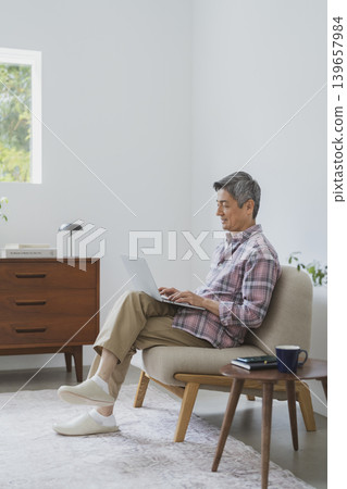 Senior man working on a laptop Senior man working on a laptop 139657984