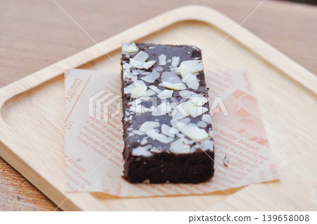 brownie , chocolate cake with almond topping brownie , chocolate cake with almond topping 139658008