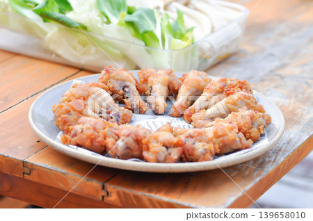 fried chick with fried garlic or chicken wings or deep fried chicken , fried chicken fried chick with fried garlic or chicken wings or deep fried chicken , fried chicken 139658010