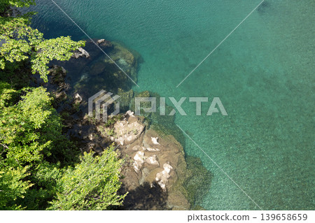 Emerald green river and white sandy beach Emerald green river and white sandy beach 139658659